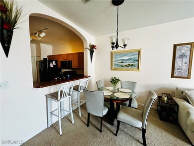 Dining area featuring a notable chandelier and lig