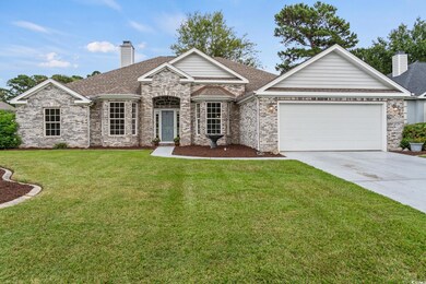 View of front of property with a garage and a fron