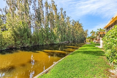View of yard with a water view