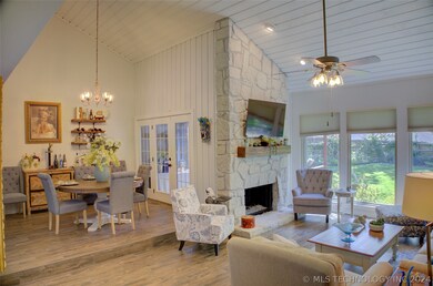 Open concept living and dining with vaulted ceilin