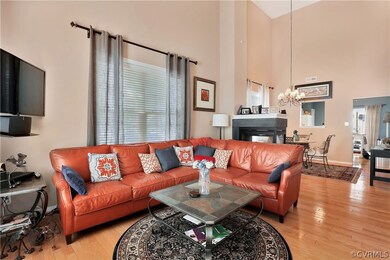 Living area is separated from the Dining area by a 3-Sided Gas Fireplace