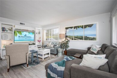 Living room with light hardwood / wood-style floor