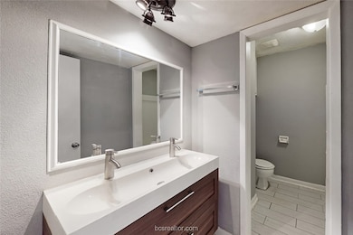 Bathroom featuring toilet and vanity
