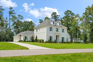 Lots of parking with side yard and golf cart bay!