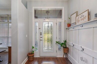 Foyer, wainscoted wall