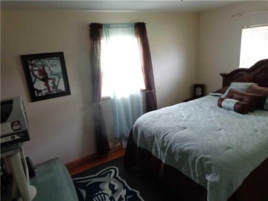 Bedroom. Hardwood floors exposed in this bedroom- 