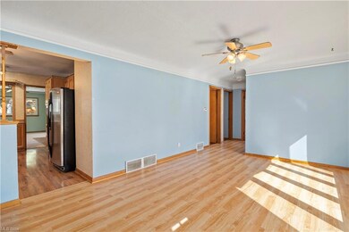 Laminate floor with ceiling fan.