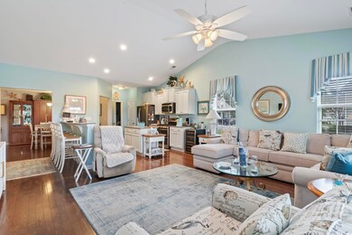 Living room featuring beverage cooler, lofted ceil