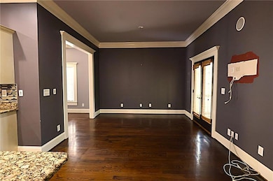 Breakfast area with crown molding, and wood finish
