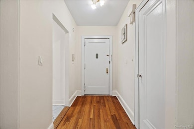 Entryway featuring hardwood finished floors