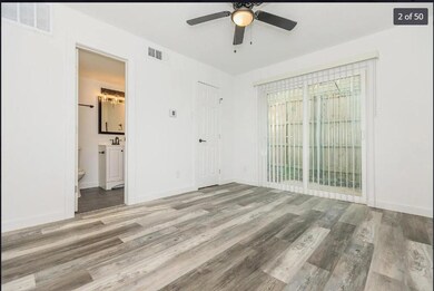 Unfurnished bedroom with wood finished floors, vis