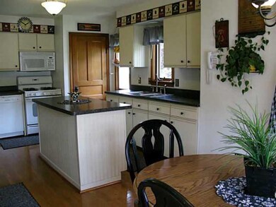 Kitchen. Lovely white cabinetry. some natural wood