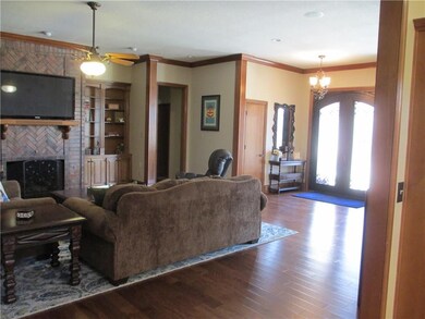 Central entrance into living room. Hardwood floors