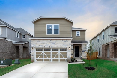 View of front facade featuring stone siding, an a