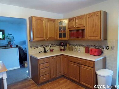 Kitchen. New flooring, new counters, new tile.
