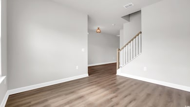 Entrance foyer featuring wood finished floors and stairs