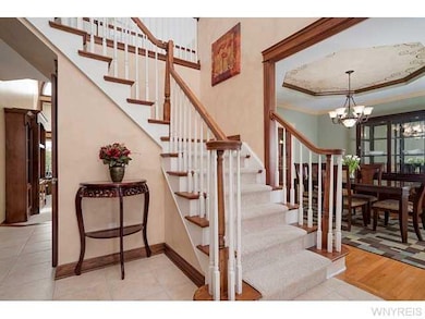 Foyer. Two story foyer opens to formal dining room