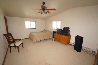the master suite features a cathedral ceiling, cei