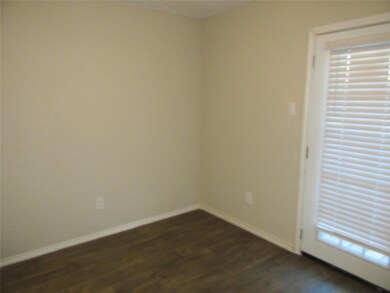 Empty room featuring dark hardwood / wood-style fl