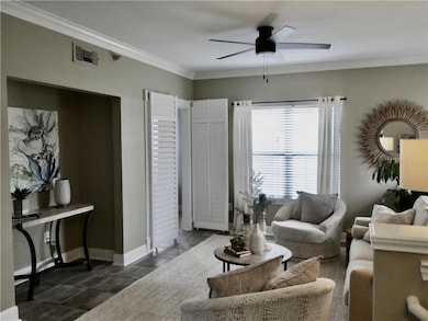 Another view of the Living Room with nook perfect for a TV. Window treatments stay with the home!