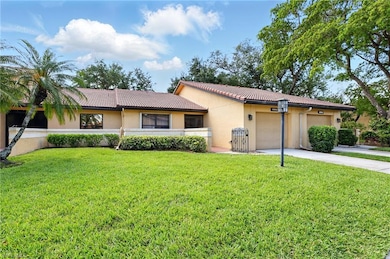 Single story home featuring a tiled roof, stucco s
