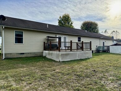 Back of house with deck.
