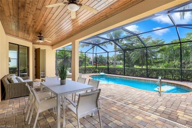 Outdoor pool with ceiling fan, a patio, glass enclosure, and outdoor dining area