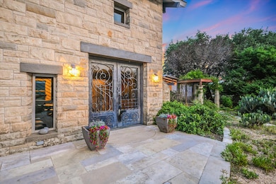 Exterior entry at dusk featuring french doors and
