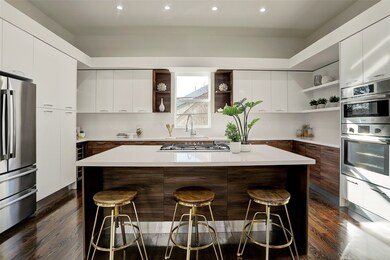 Stunning chef's kitchen has ample storage and an e