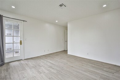 Empty room featuring light wood-style flooring, re