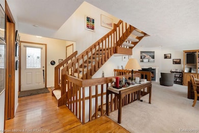 Warm & welcoming foyer w/hardwood flooring