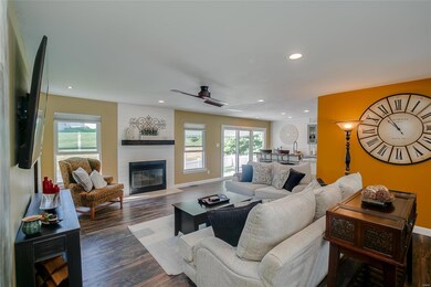 Great room with newer flooring and newer recessed 