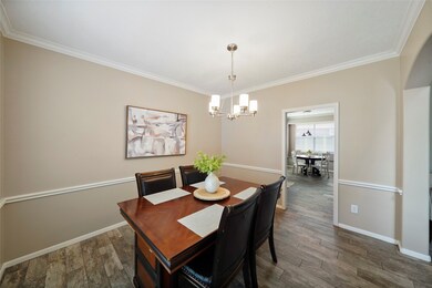 Dining room opens to the kitchen.  Wood tile flooring extends throughout the whole first floor!