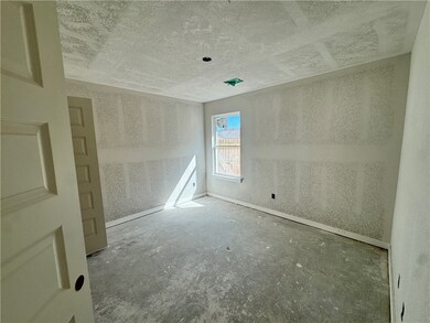 Unfurnished room with a textured ceiling