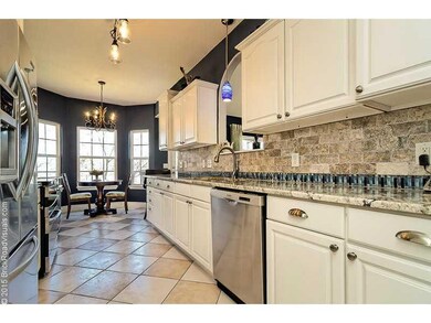 Kitchen. Updated galley kitchen with stainless appliances .