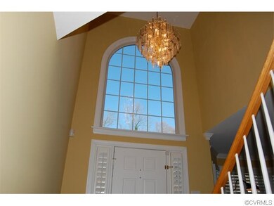 BEAUTIFUL HALF CIRCLE WINDOW IN FOYER!