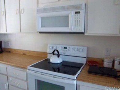 Kitchen Stove and Microwve counters and Whit Cabin