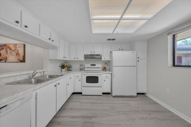 Laminate flooring and nice overhead lighting