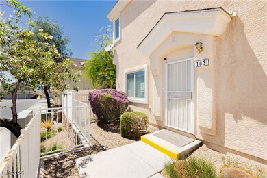Entrance to property with stucco siding