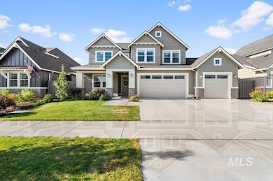 Craftsman inspired home with driveway, a front lawn, and a garage
