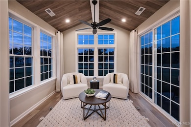 Sunroom / solarium featuring wood ceiling, ceiling