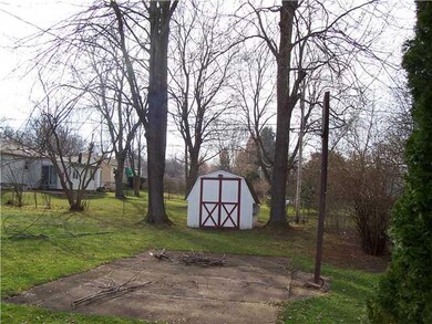 Exterior Back Large fenced yard with patio, shed a
