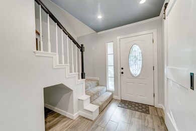 The entry is welcoming with designer colors, light