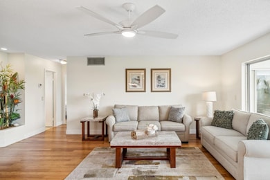 Living room with gorgeous bamboo wood flooring!