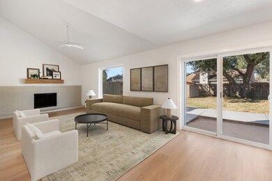 Spacious open living space features a vaulted ceil