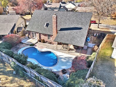 Beautiful landscaping and a dog run off the garage