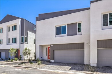 View of front of home with an attached garage, decorative driveway, and stucco siding