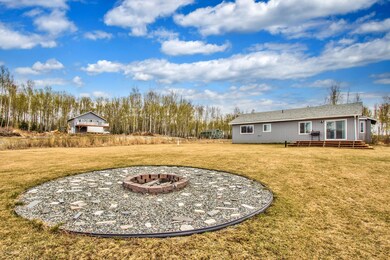 Landscaping and fire pit in back yard