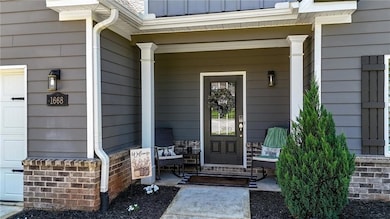 View of exterior entry with a porch