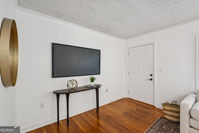 Beautifully refinished hardwood floors make a welcome entry into your home.